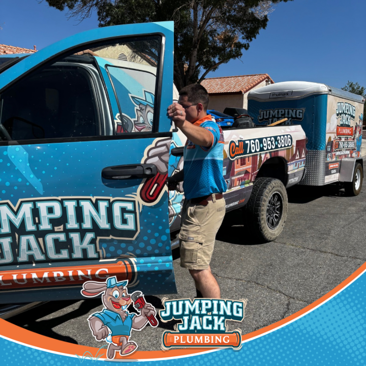 Jumping Jack Plumbing branded truck and trailer in Victorville