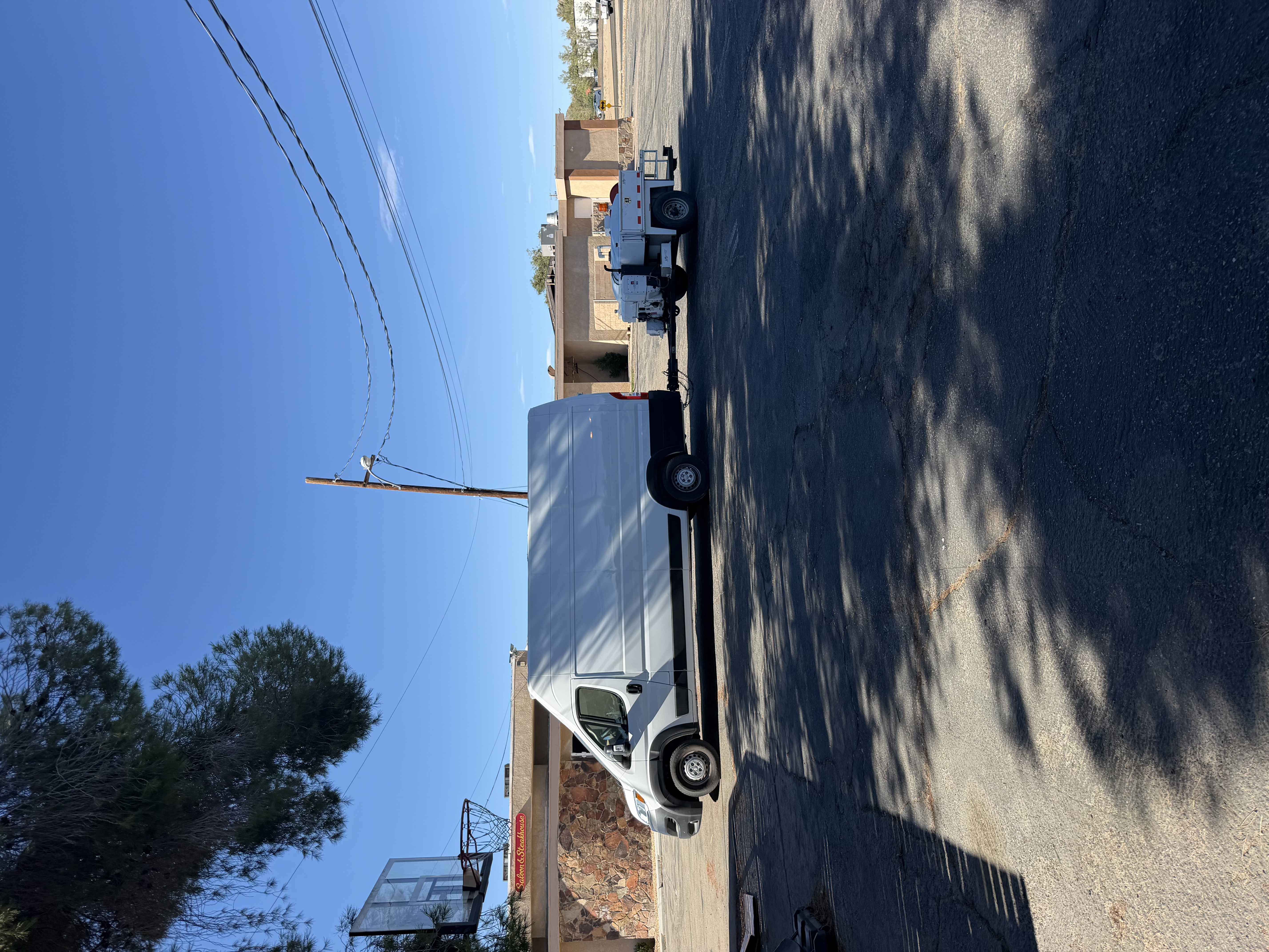 Jumping Jack Plumbing van towing the hydro jetting trailer in Victorville